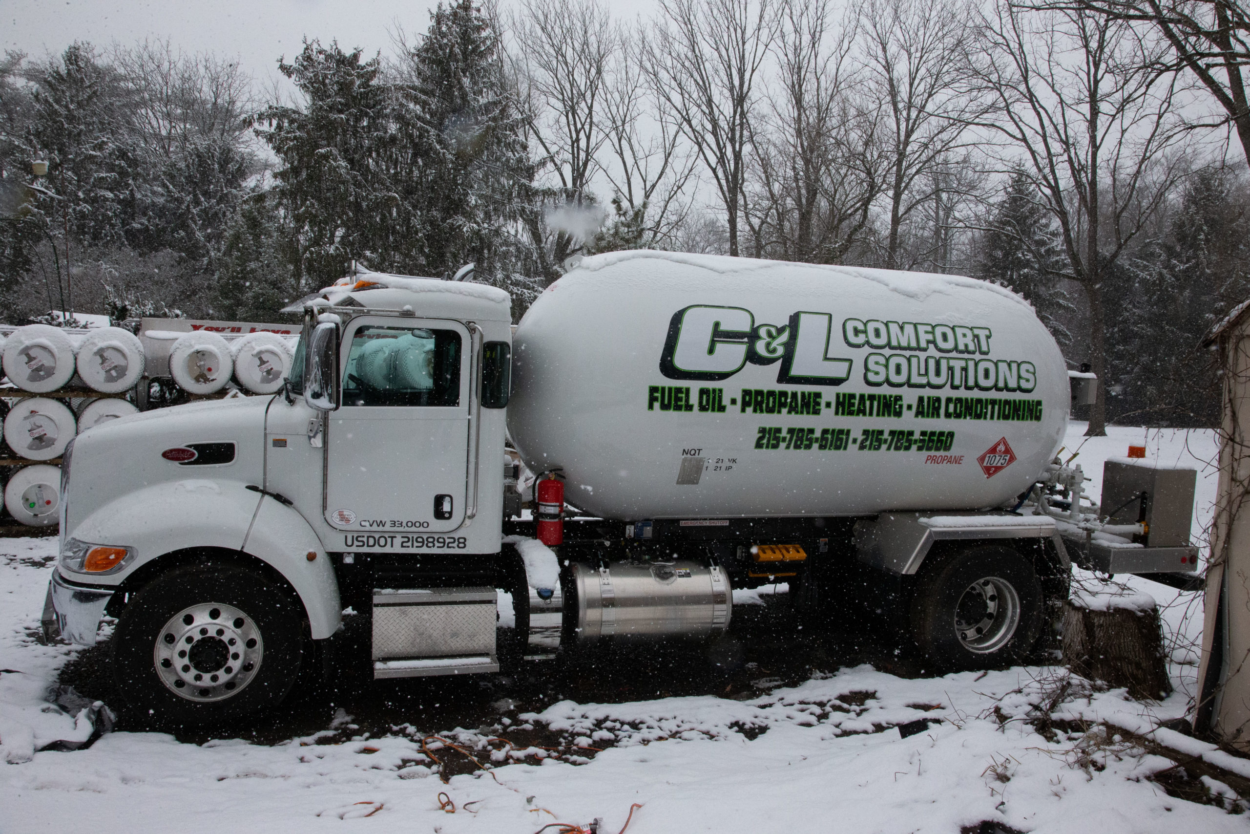 C&L Comfort Solutions truck parked in the snow