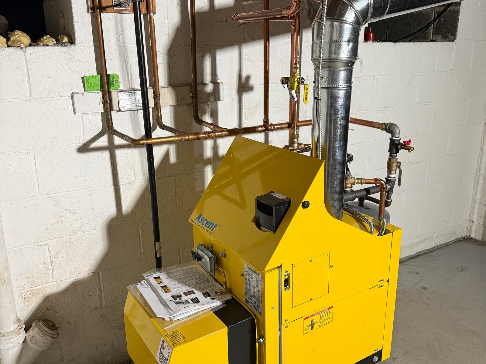 Energy Kinetics Ascent boiler installed in a basement