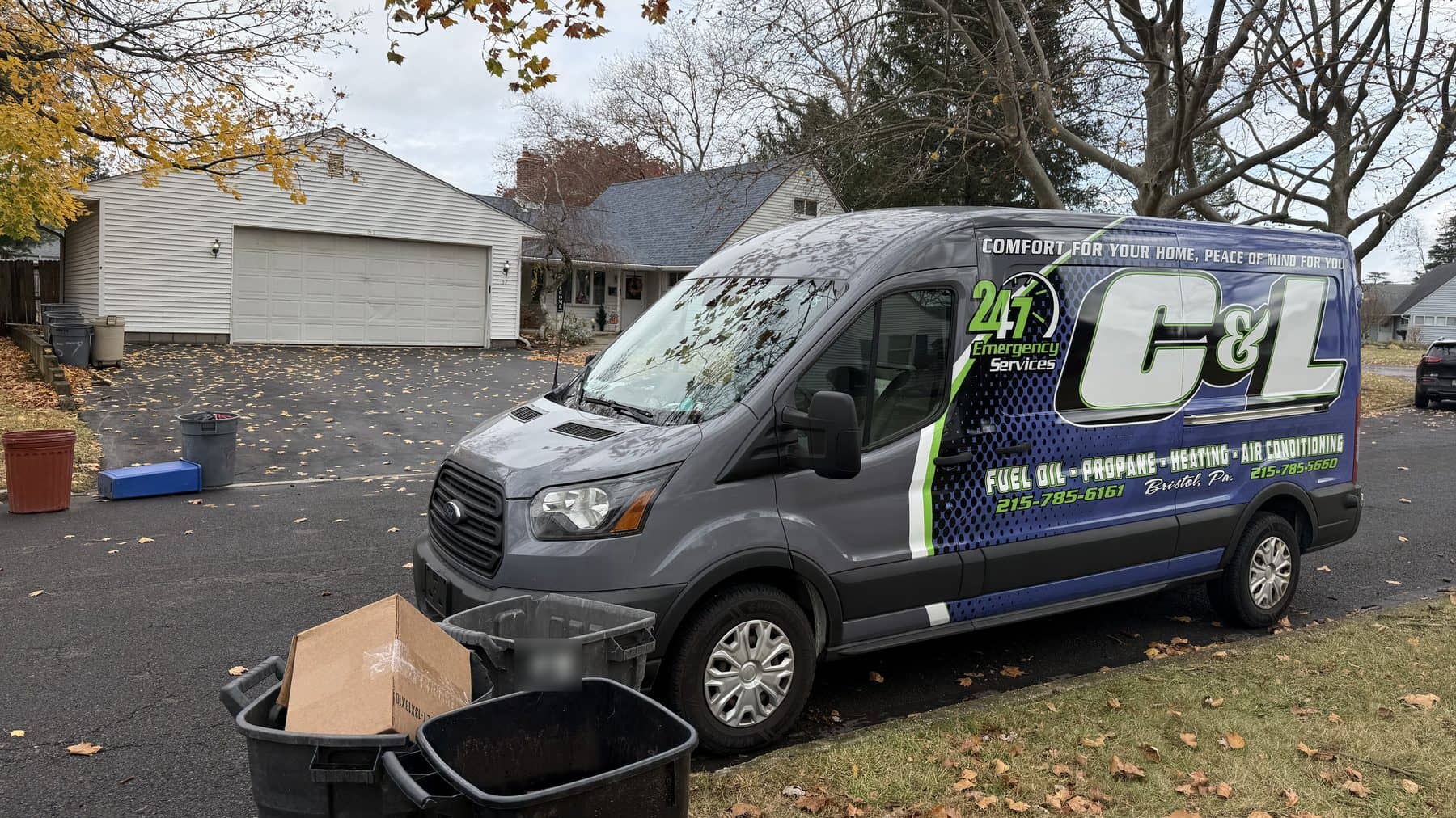 C&L Fuel Inc. service van parked on a residential street in the fall