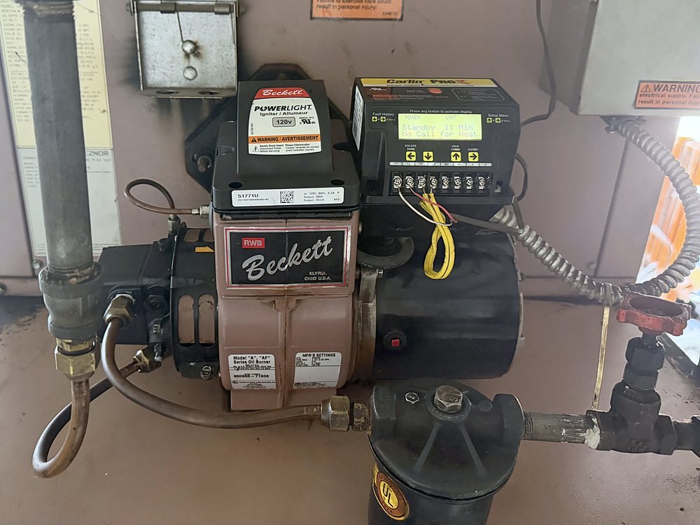 Clean oil burner and primary control after service