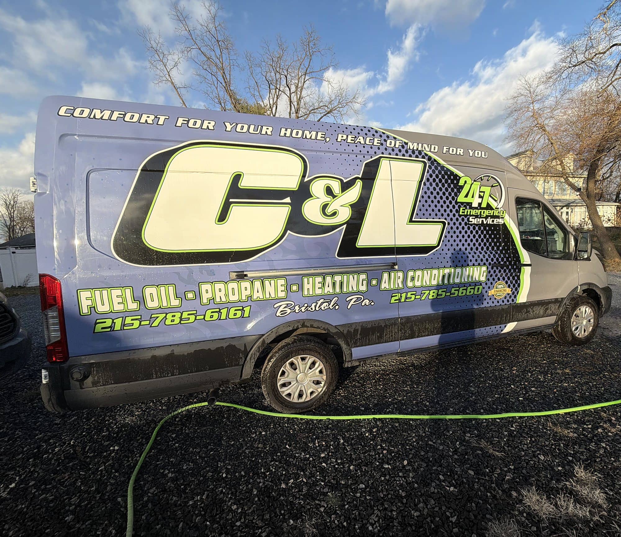 Side view of the C&L Fuel Inc. service van with its full wrap