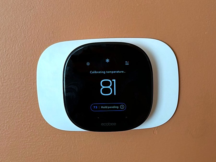 New smart thermostat mounted on a wall