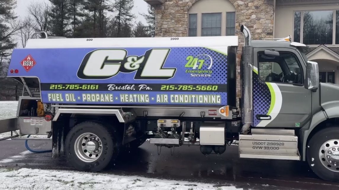 C&L Fuel oil delivery truck parked in the snow